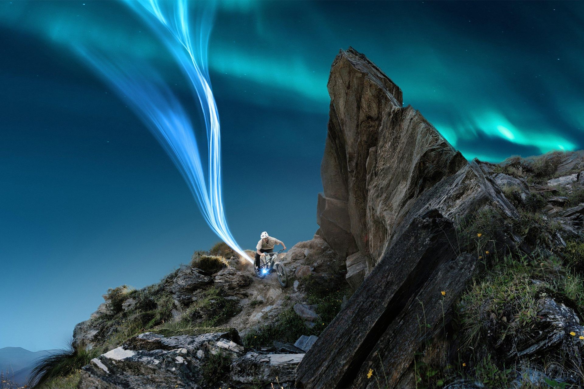 Rock formation under a glowing night sky
