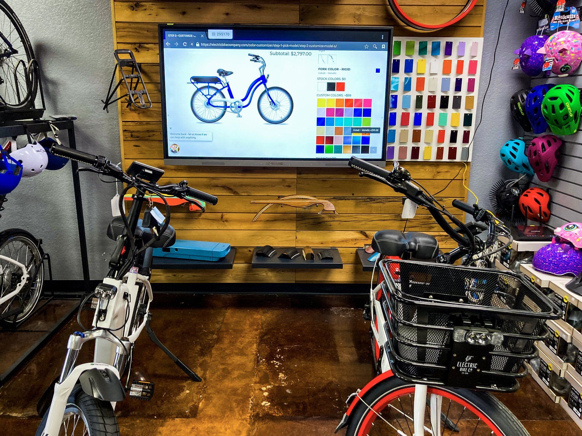 E-bike display and helmet wall in the Lake Havasu Bike showroom